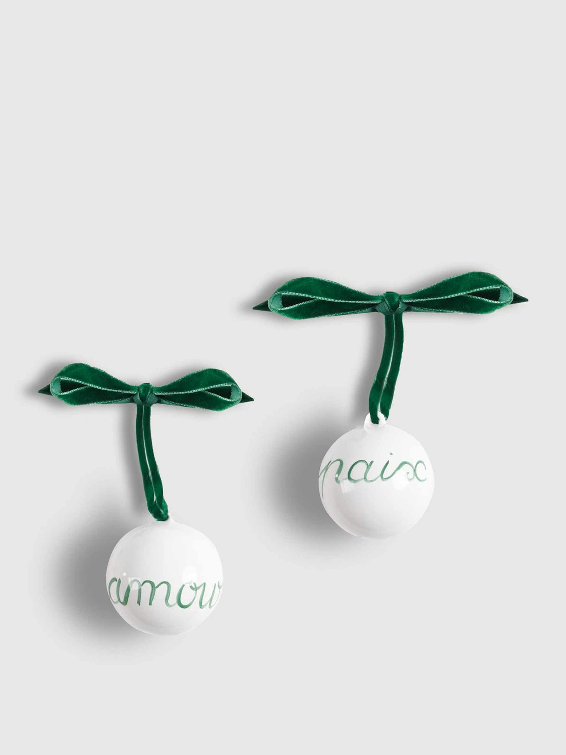 Two Christmas baubles, "paix" and "amour"